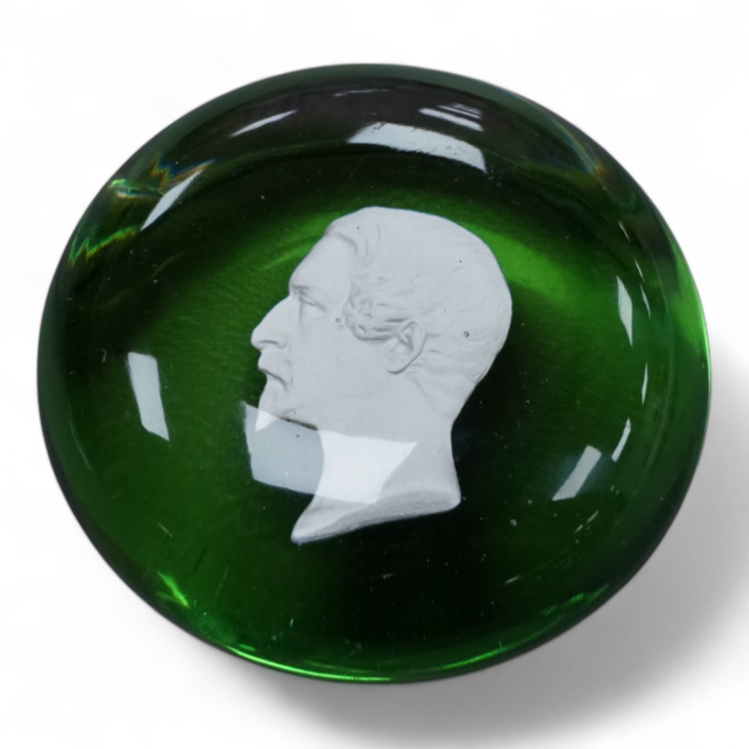 A Clichy Napoleon III sulphide paperweight, green pedestal foot. base 6cm diameter.